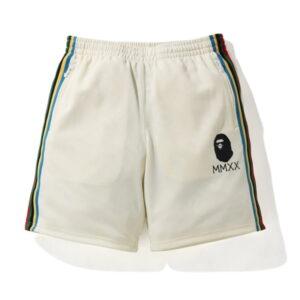 BAPE A Swimming Ape Short en jersey à bande latérale ivoire noir 479900